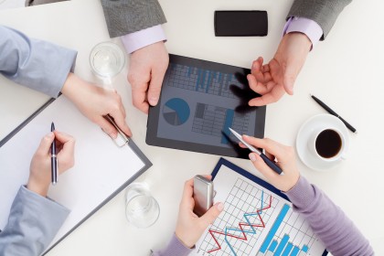 business people’ hands with Liquid-Crystal Displa